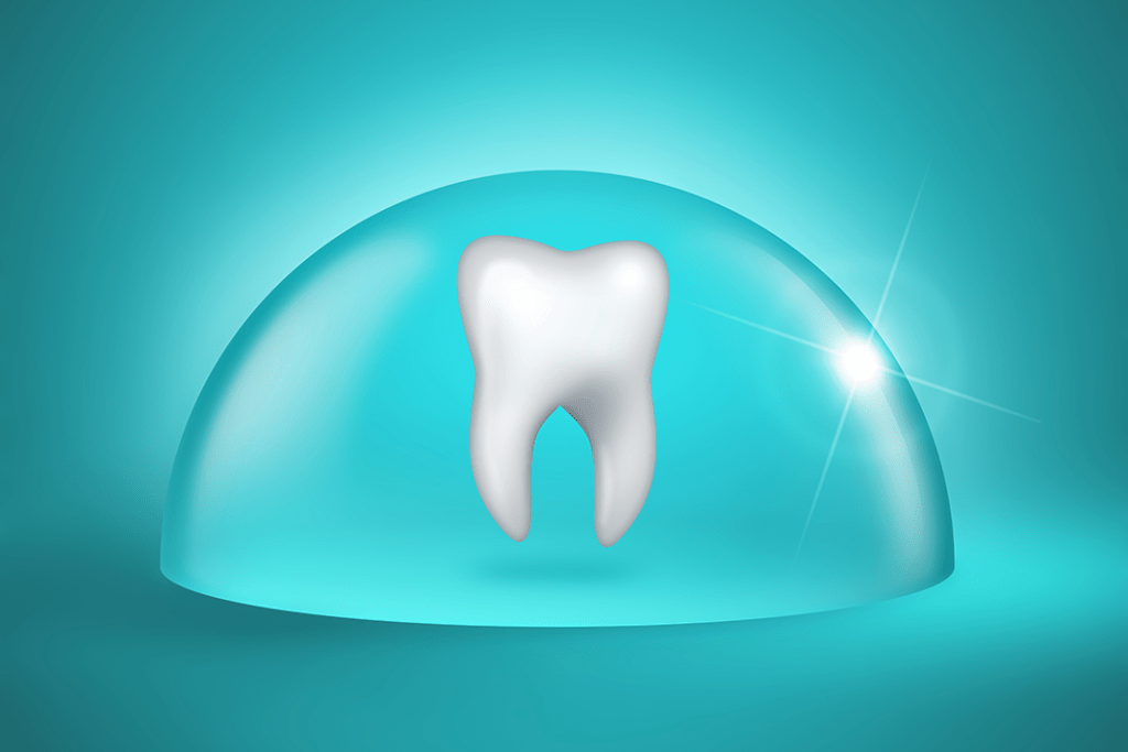 Molar tooth inside of a clear protective dome shield. Sealants, fluoride, cavities, prevention and protection.