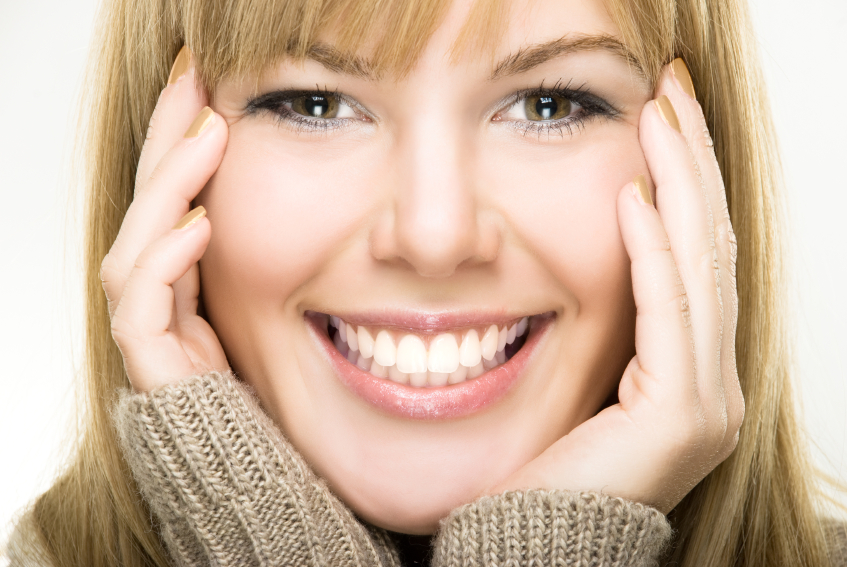 Close-up of smiling woman, white teeth, healthy gums.